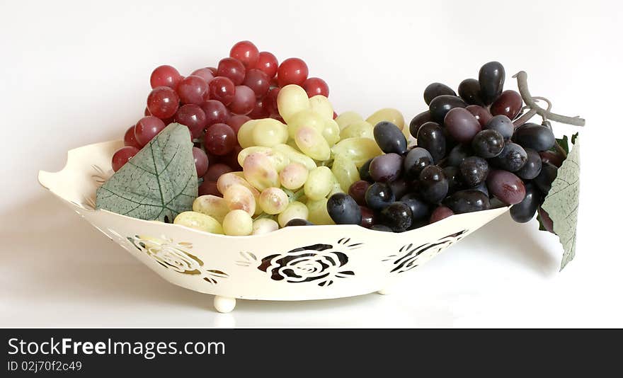 Still Life with ripe grapes on a white background