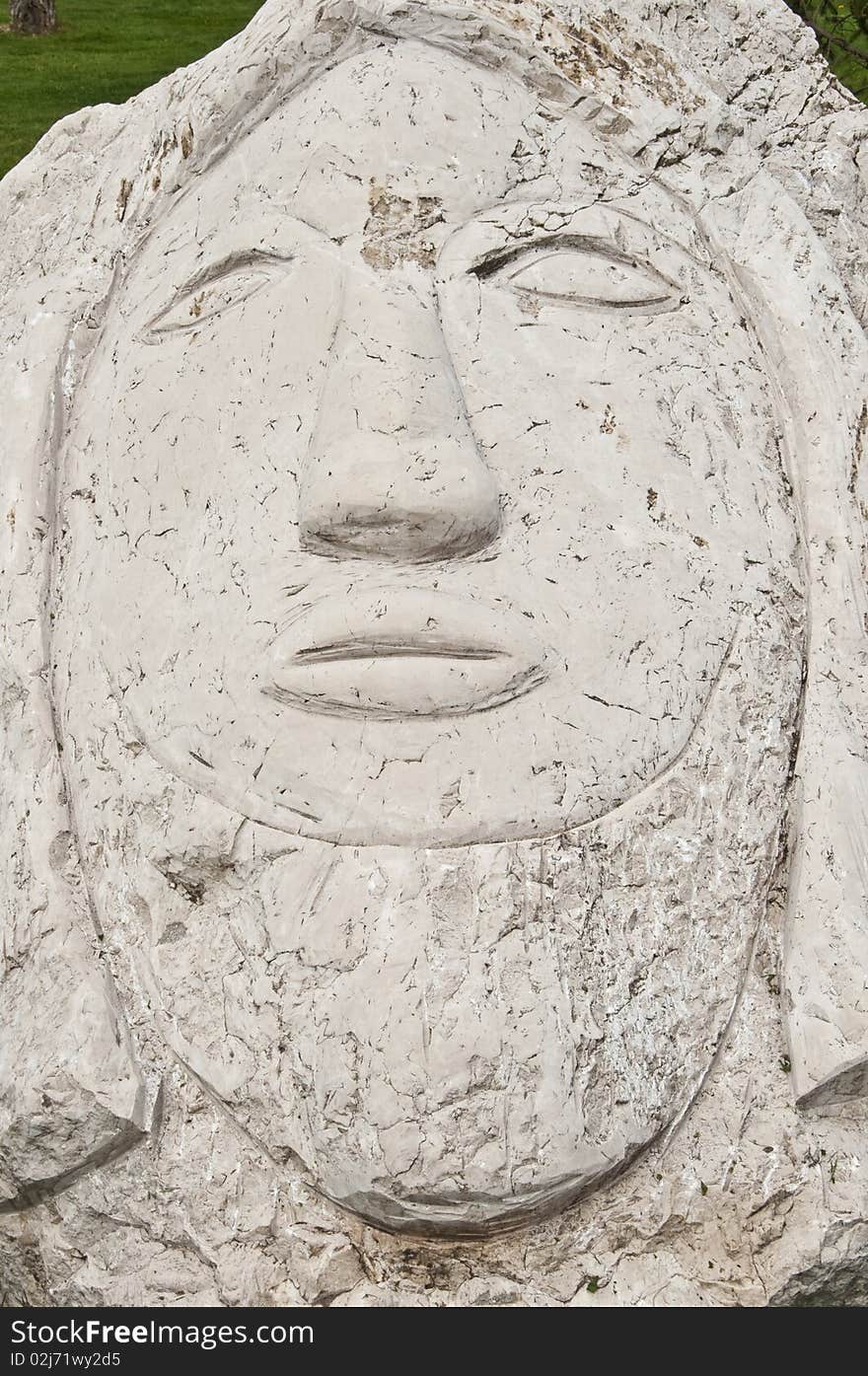 Human face engraved on the stone. Human face engraved on the stone