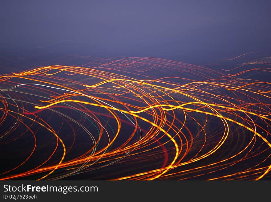 The movement of the street lights and a slow shutter speed gives the image a good point of interest. The movement of the street lights and a slow shutter speed gives the image a good point of interest.