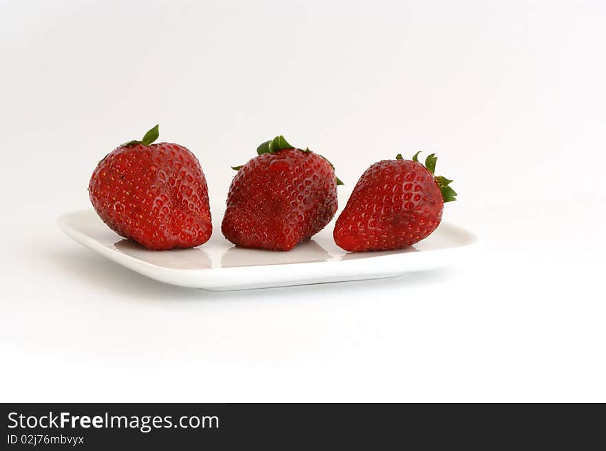 Most natural red strawberries, still life, isolated over white background