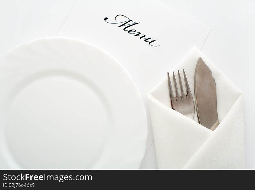 An image of a plate, knife and fork. An image of a plate, knife and fork