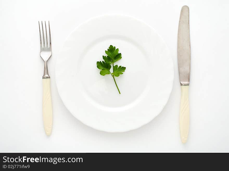 An image of fork, knife and plate