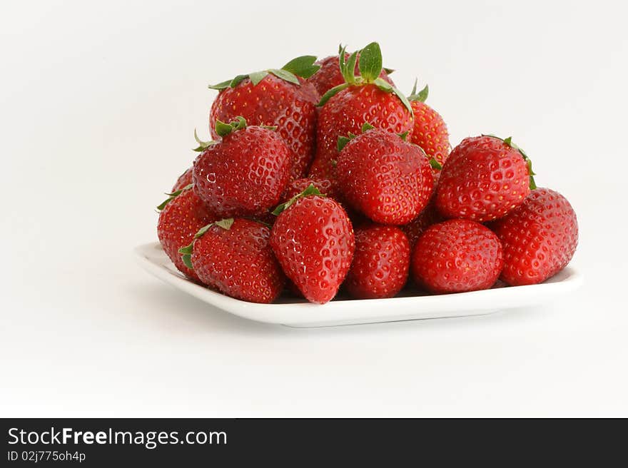 Most natural red strawberries, still life, isolated over white background