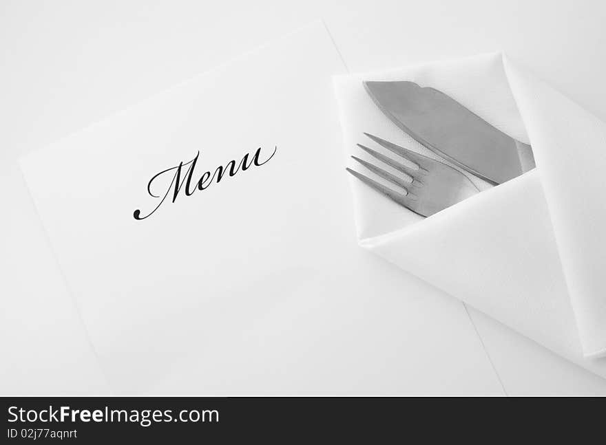 An image of fork and kife in napkin. An image of fork and kife in napkin