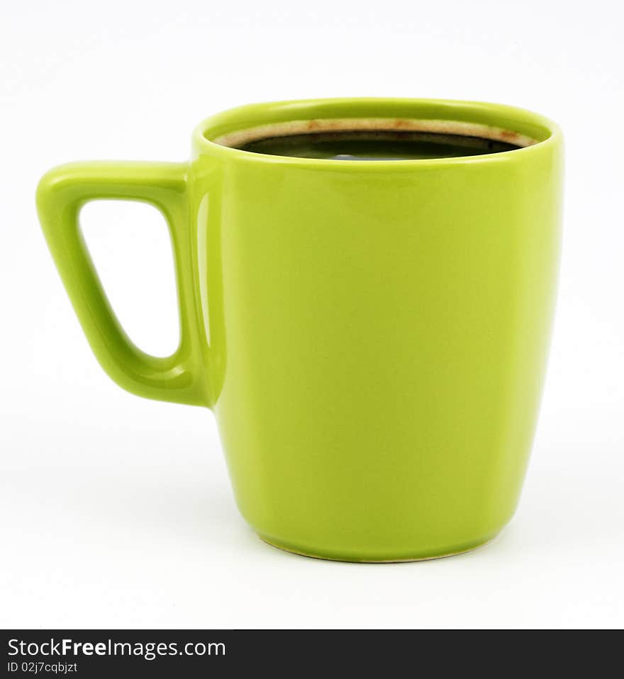 Green cup of coffee on a white background