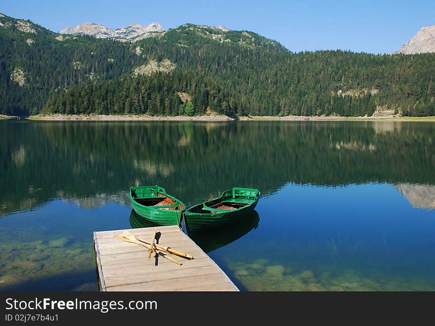 Mountain lake and two boats