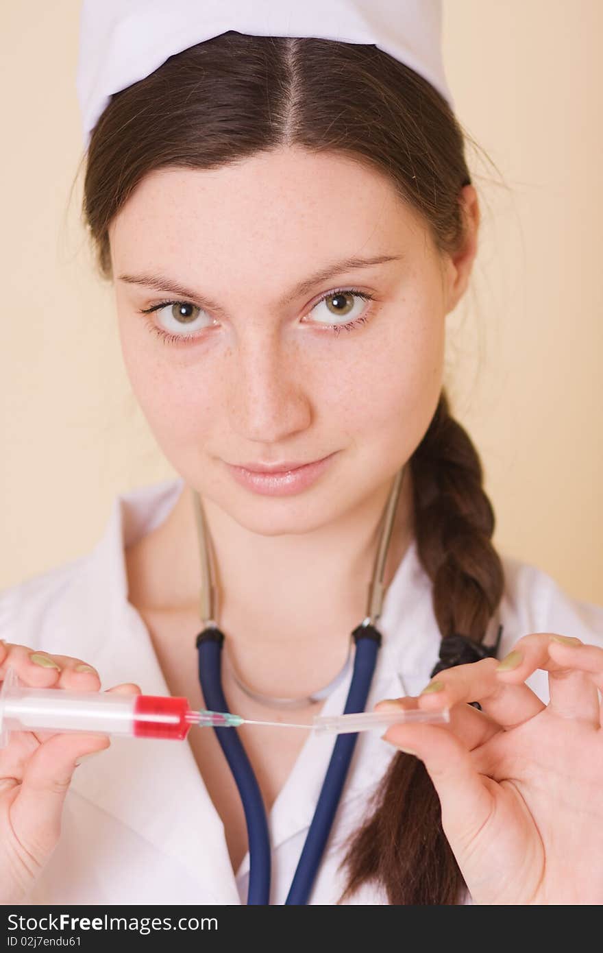 Nurse With Syringe And Stethoscope