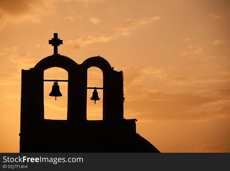 Greek church in santorini greece with a cross