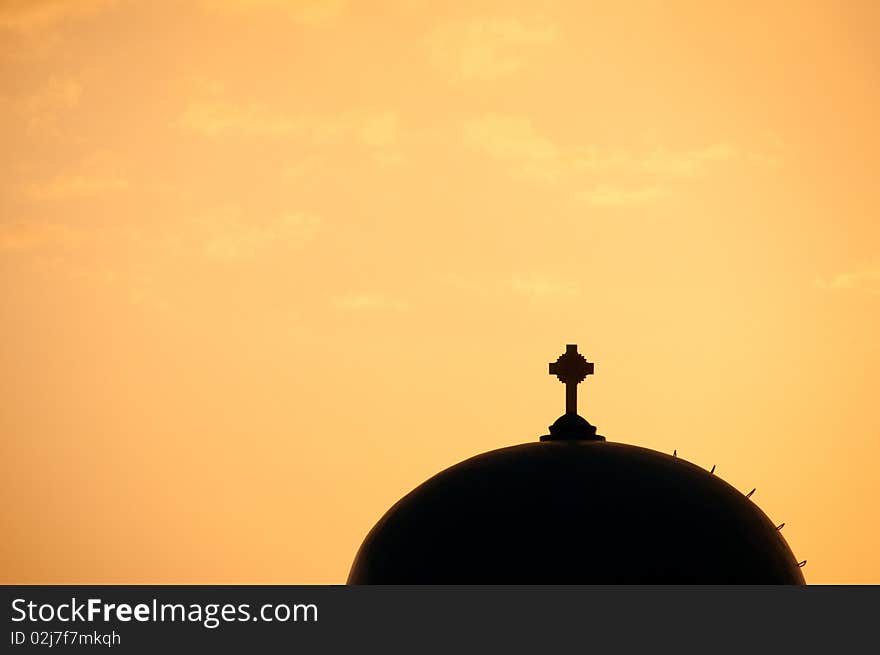 Greek church in santorini greece with a cross