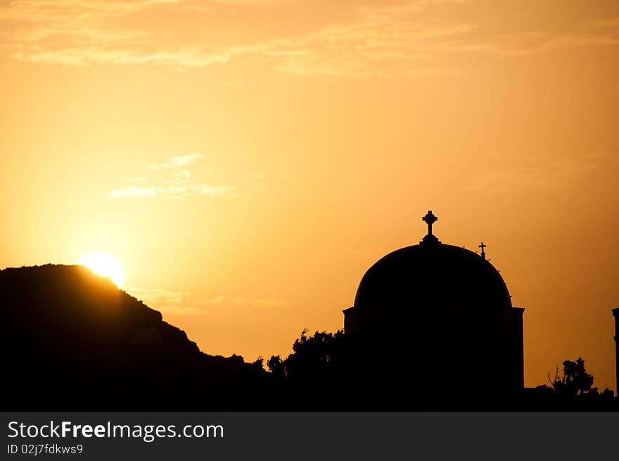 Greek church in santorini greece with a cross