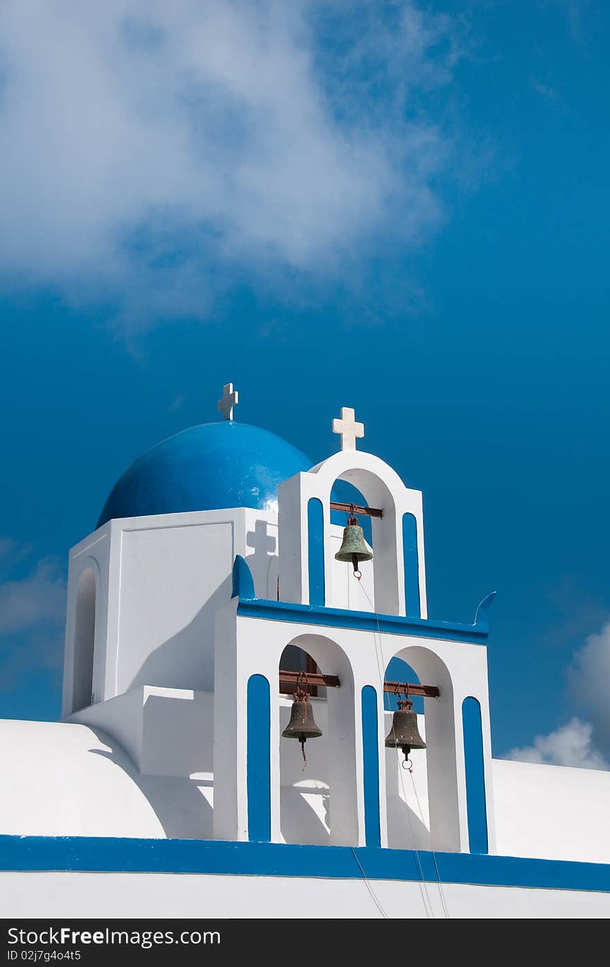 Greek church in santorini greece with a cross