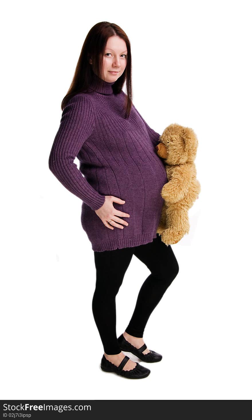 Beautiful pregnant girl in a purple sweater, isolated on white. Beautiful pregnant girl in a purple sweater, isolated on white