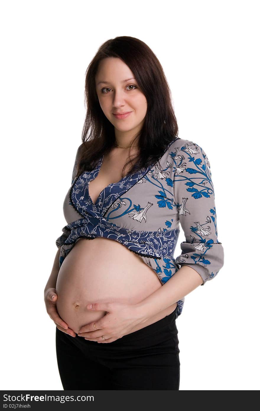 Pregnant woman embracing her stomach isolated on white. Pregnant woman embracing her stomach isolated on white