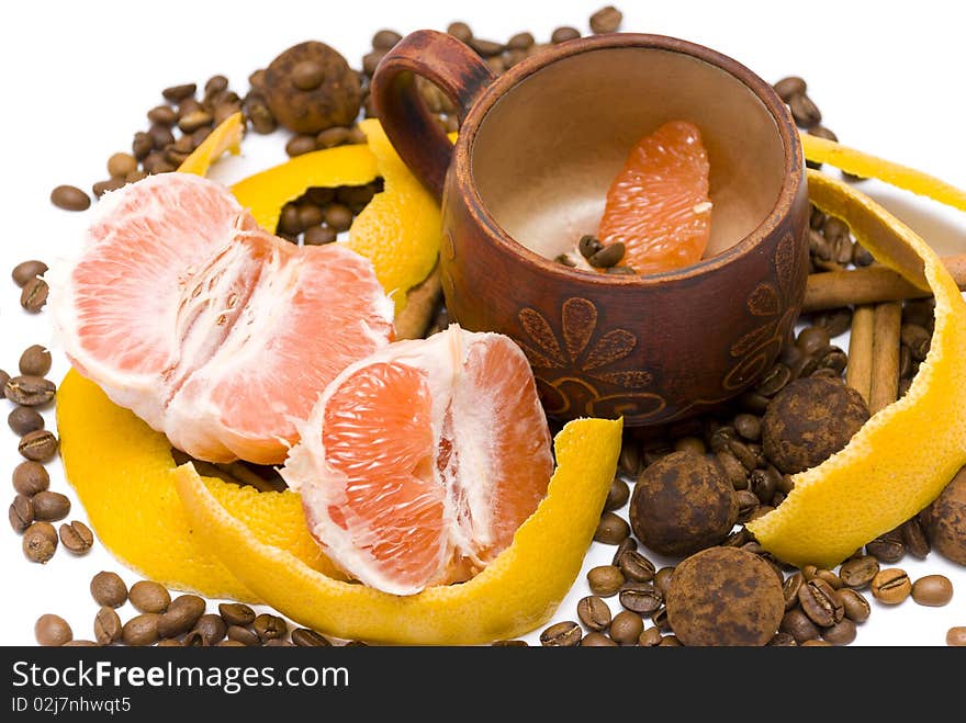 Peeled Grapefruit And A Cup