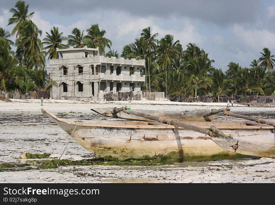 Dhow And Local Home On Zanzibar Beach