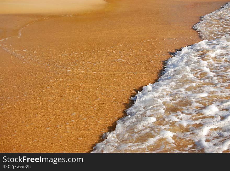 Background of wave on sand of the tropical beach