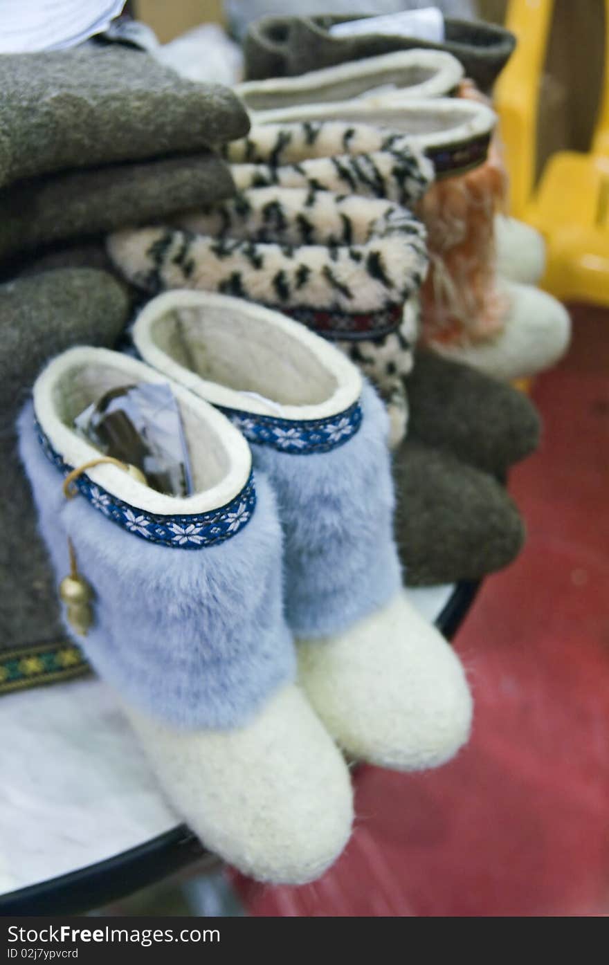 Traditional Russian felted shoes on shelf