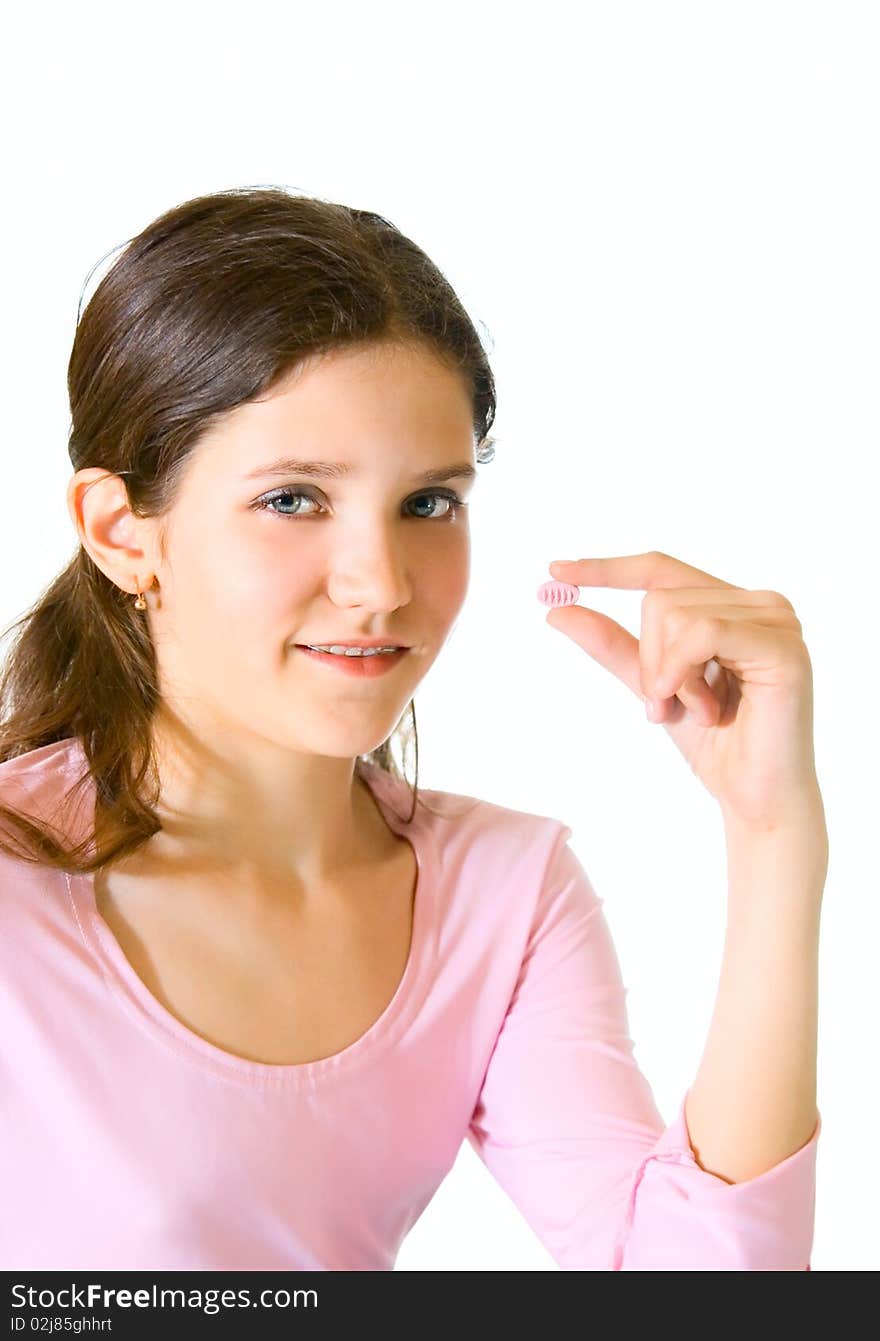 Lovely teen girl in pink with pill. Lovely teen girl in pink with pill