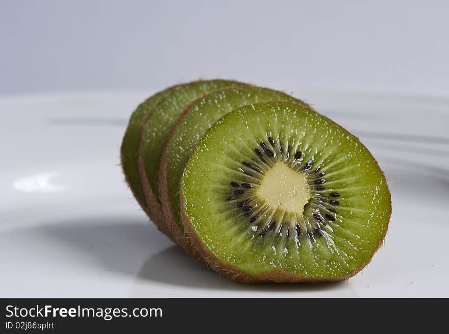 Sliced kiwi on white background