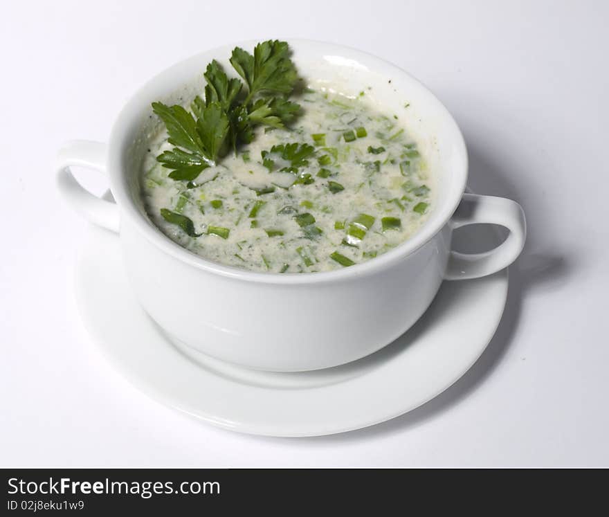 Bowl with soup over white background