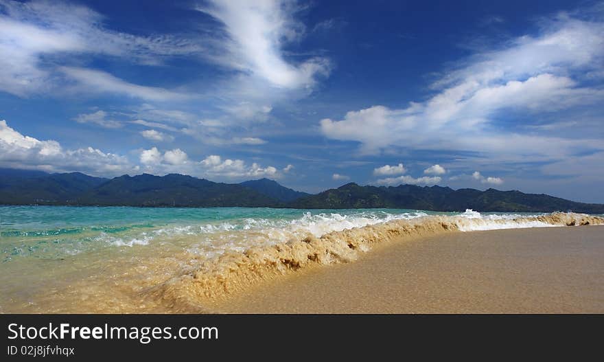 Waves breaking on a tropical Asian island. Waves breaking on a tropical Asian island