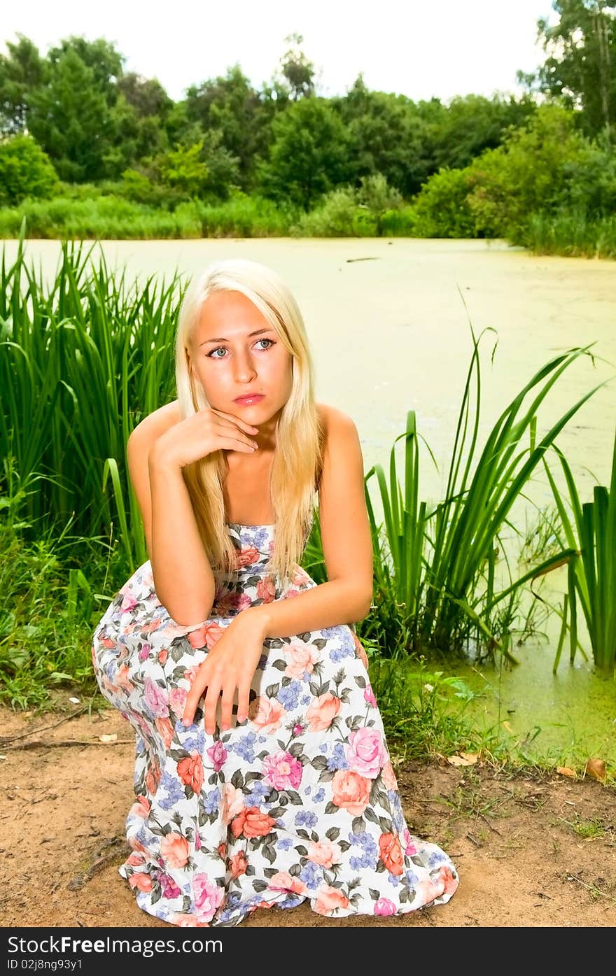 Blonde girl near the lake. Blonde girl near the lake