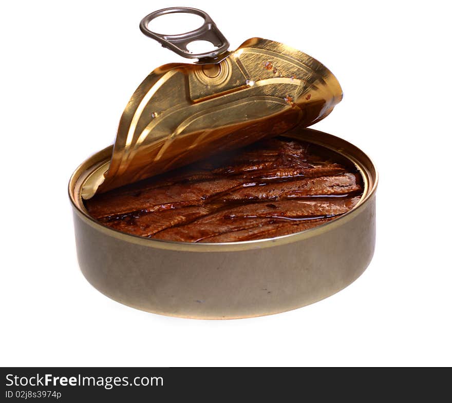 Open iron bank with canned fish in oil. Isolated object on a white background