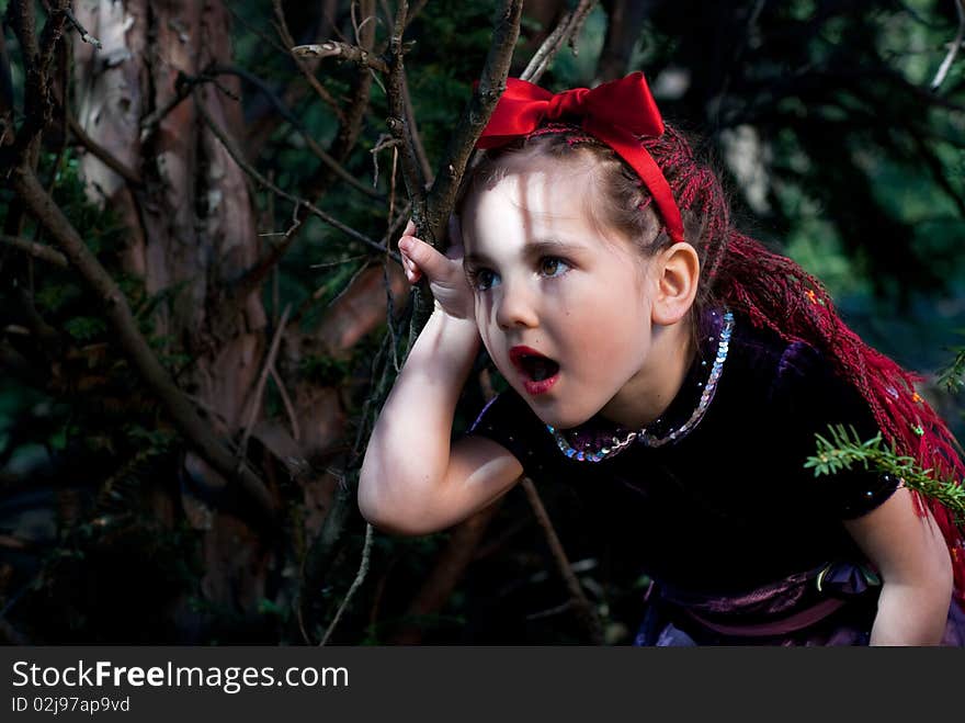 Snow white with apple, litle girl on a forest background