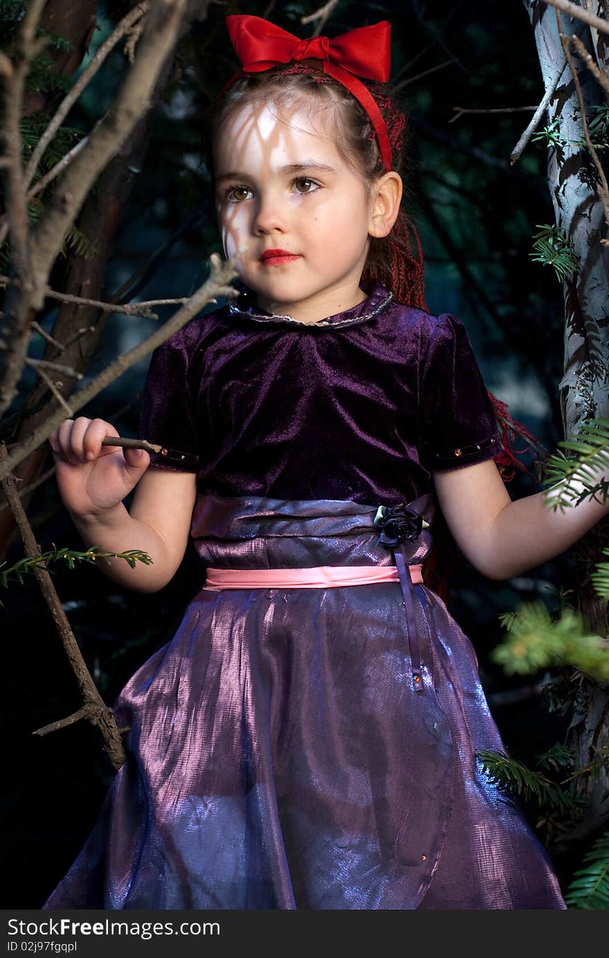 Snow white with apple, litle girl on a forest background