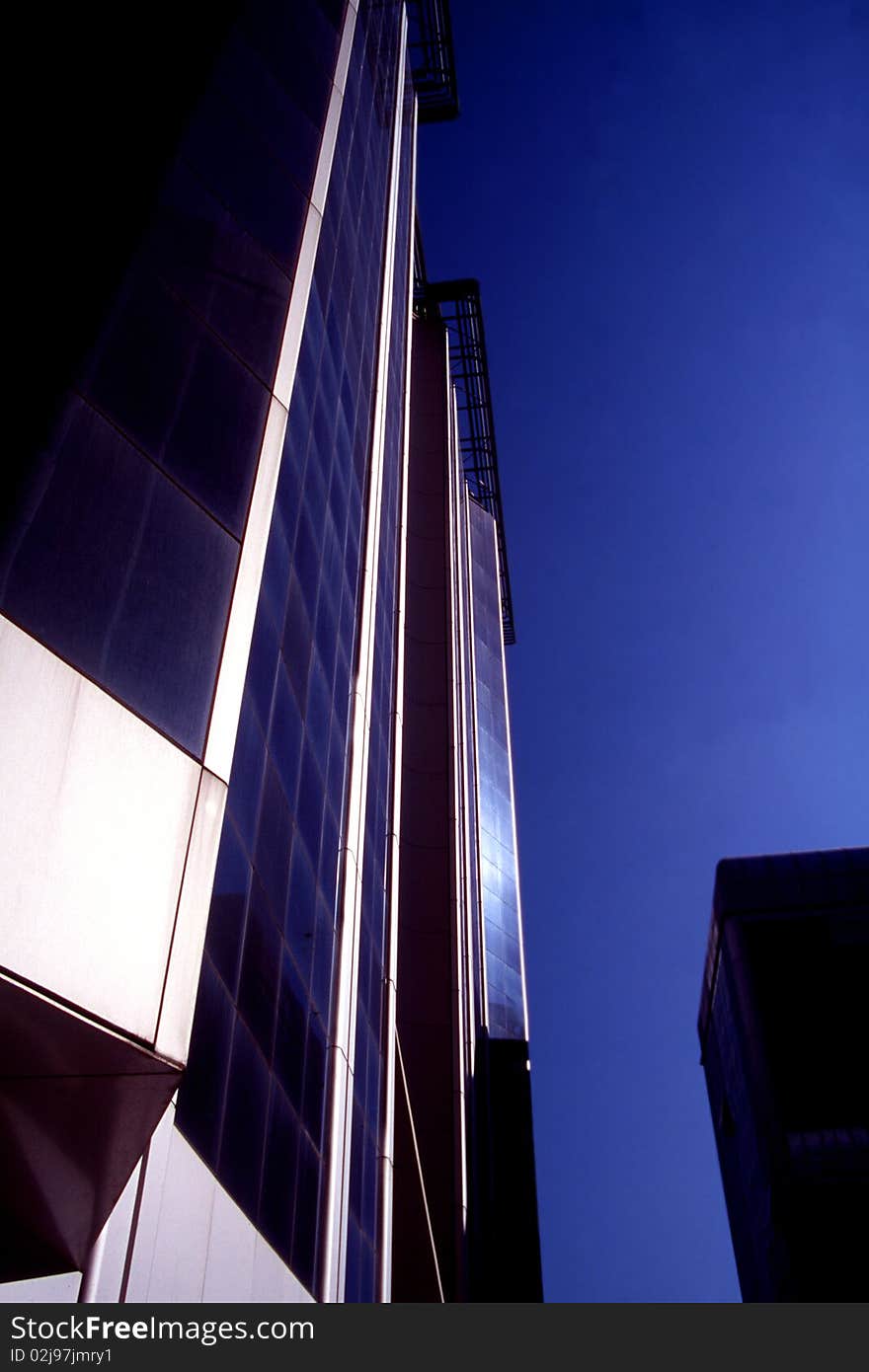 Wide-angle shot of a glass modern building. Wide-angle shot of a glass modern building