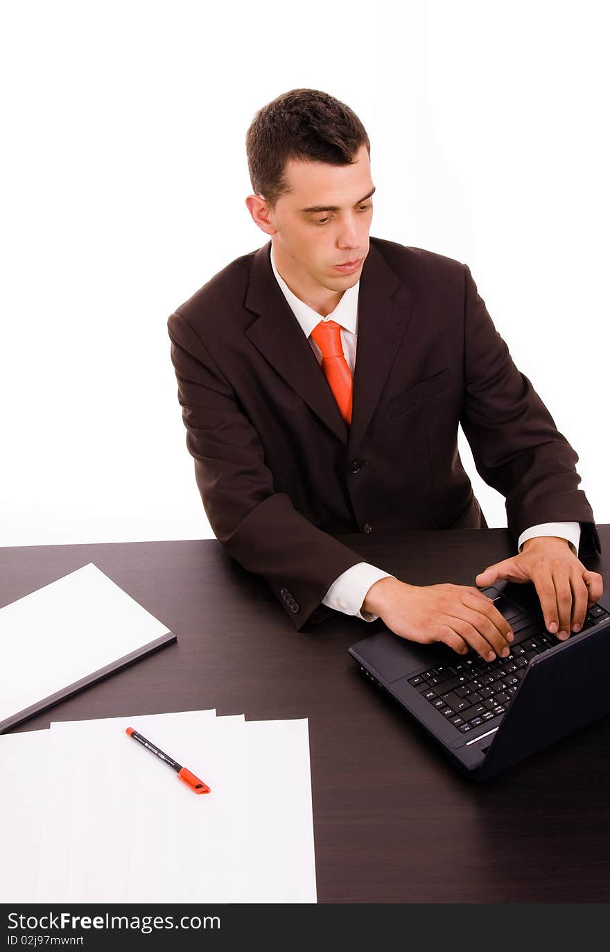 Businessman working on a laptop computer at the office