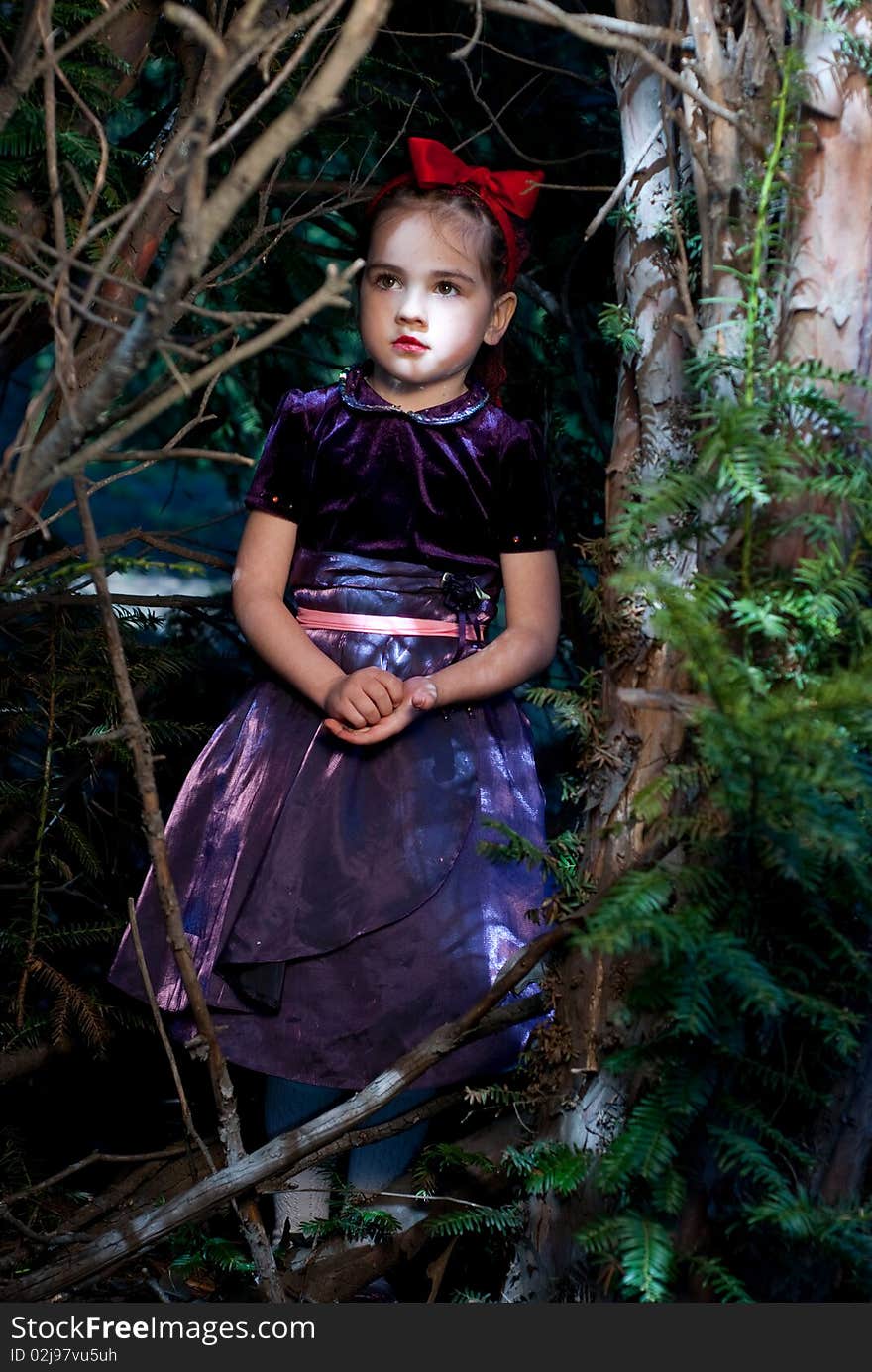 Snow white with apple, litle girl on a forest background