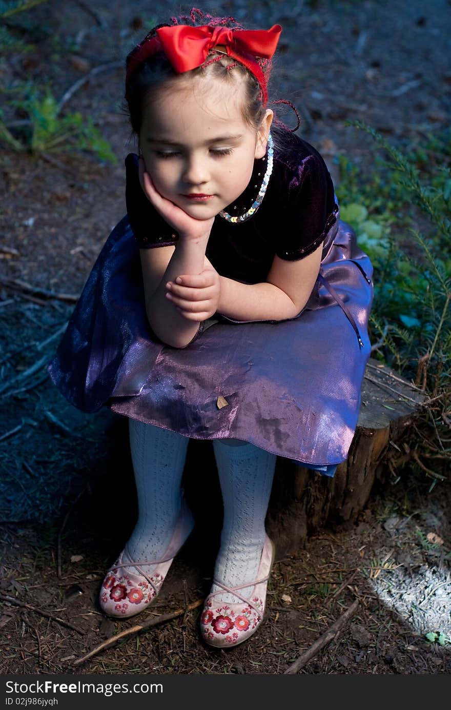 Snow white with apple, litle girl on a forest background