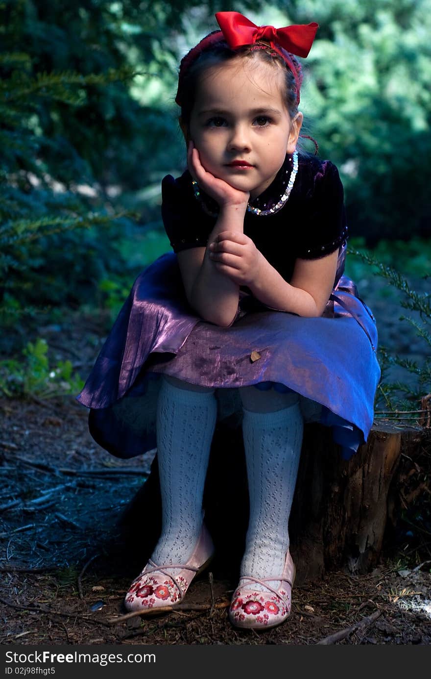 Snow white with apple, litle girl on a forest background