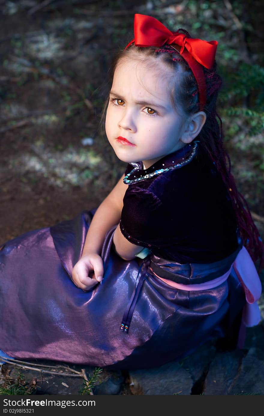 Snow white with apple, litle girl on a forest background