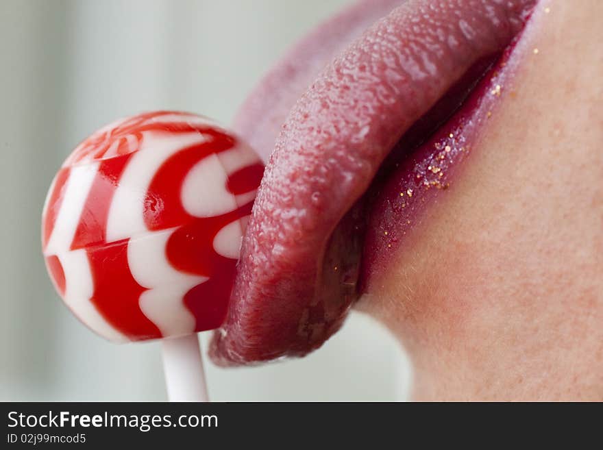 Red lips with lollipop