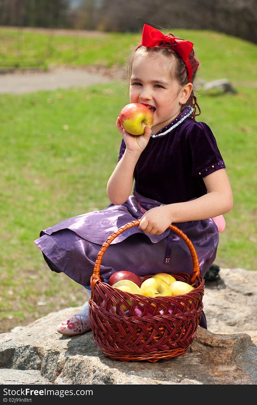 Snow white with apple, litle girl on a forest background