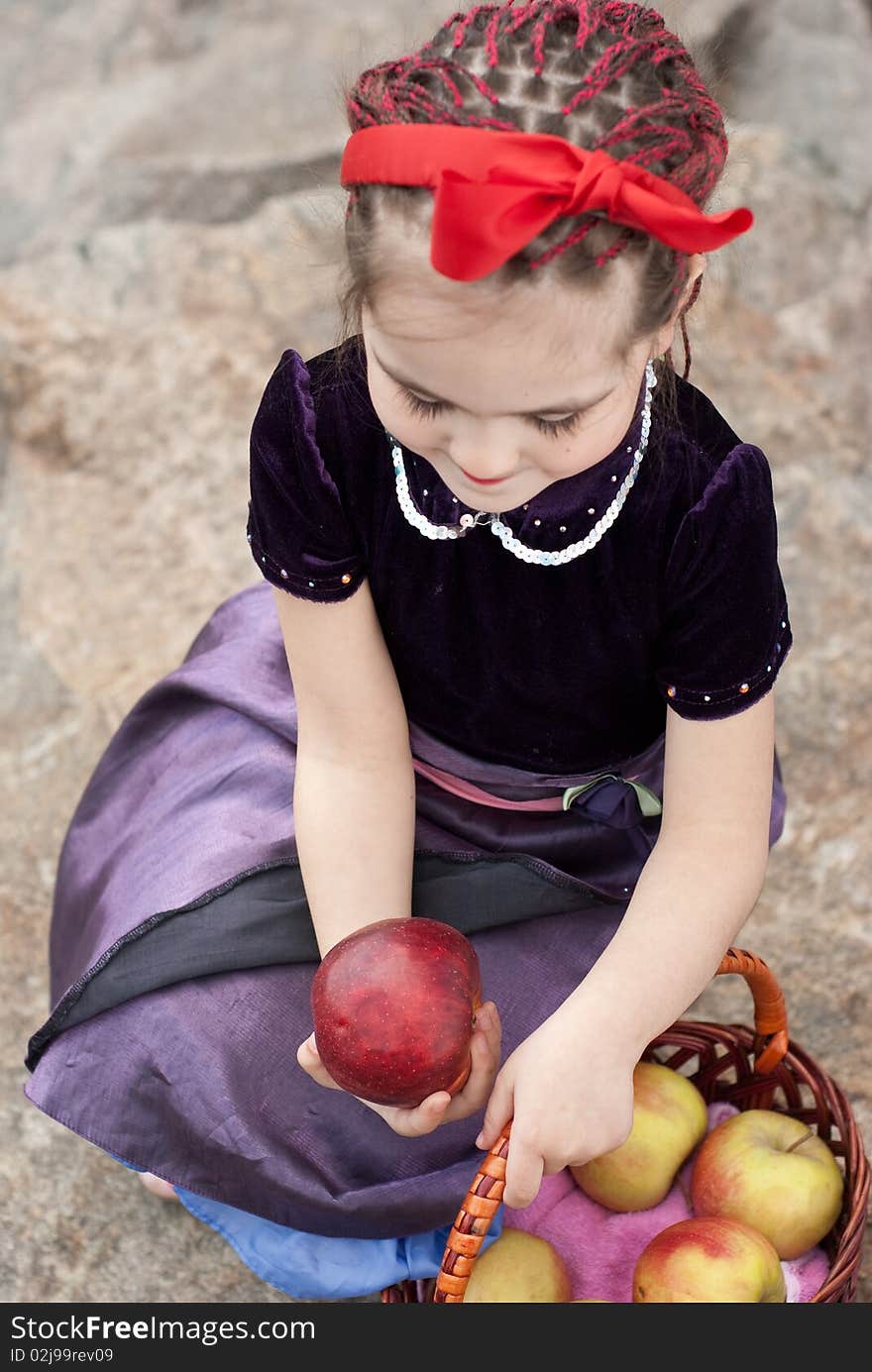 Snow white with apple, litle girl on a forest background