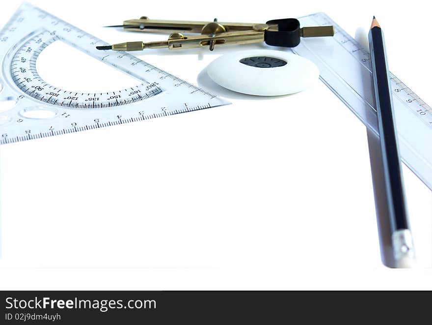 Pencil, ruler, compass and rubber on white background. Pencil, ruler, compass and rubber on white background