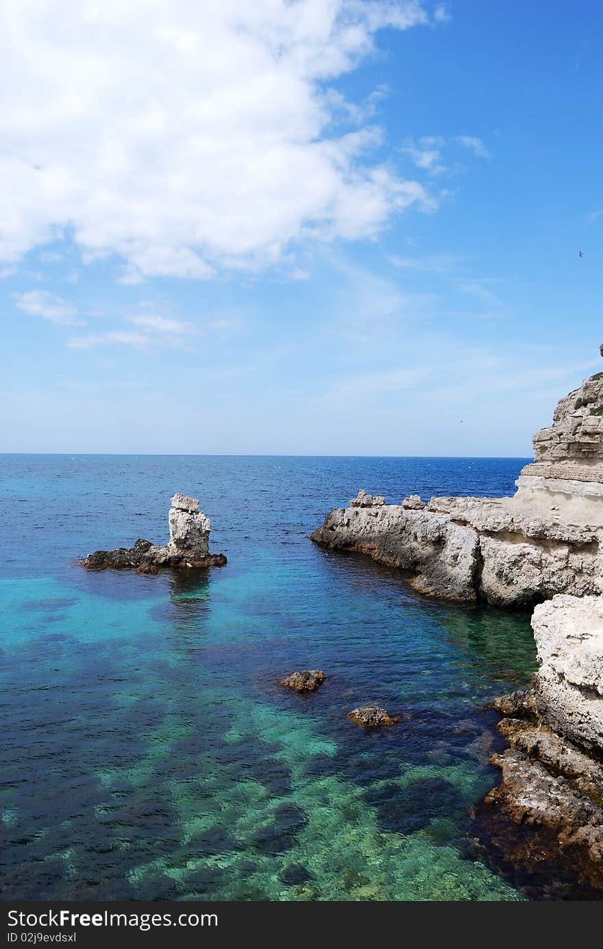 Sun shines over the bay with rocks and clear water. Western Crimea. Sun shines over the bay with rocks and clear water. Western Crimea