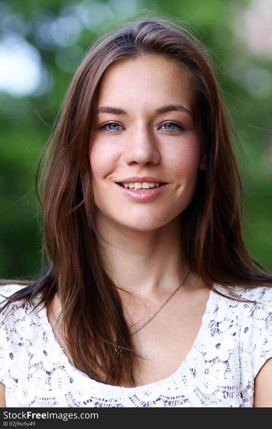 Closeup portrait of a happy young woman smiling