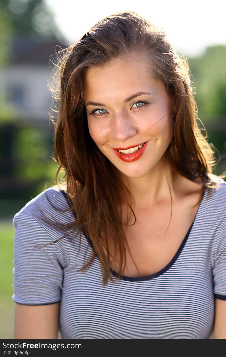 Closeup portrait of a happy young woman smiling