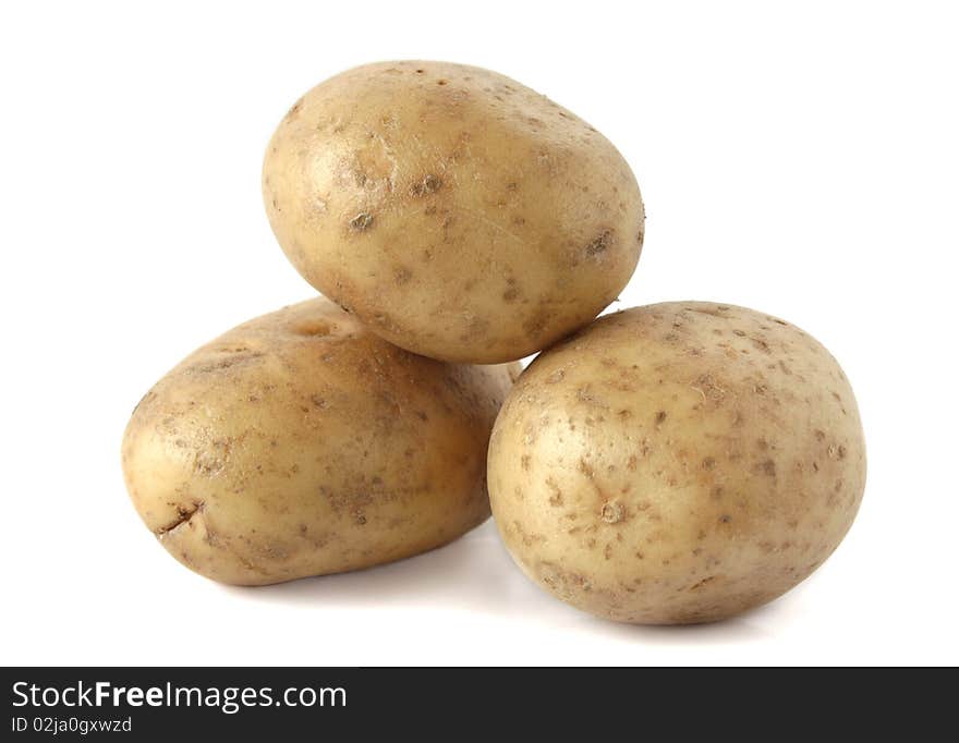 Raw potatoes on a white background