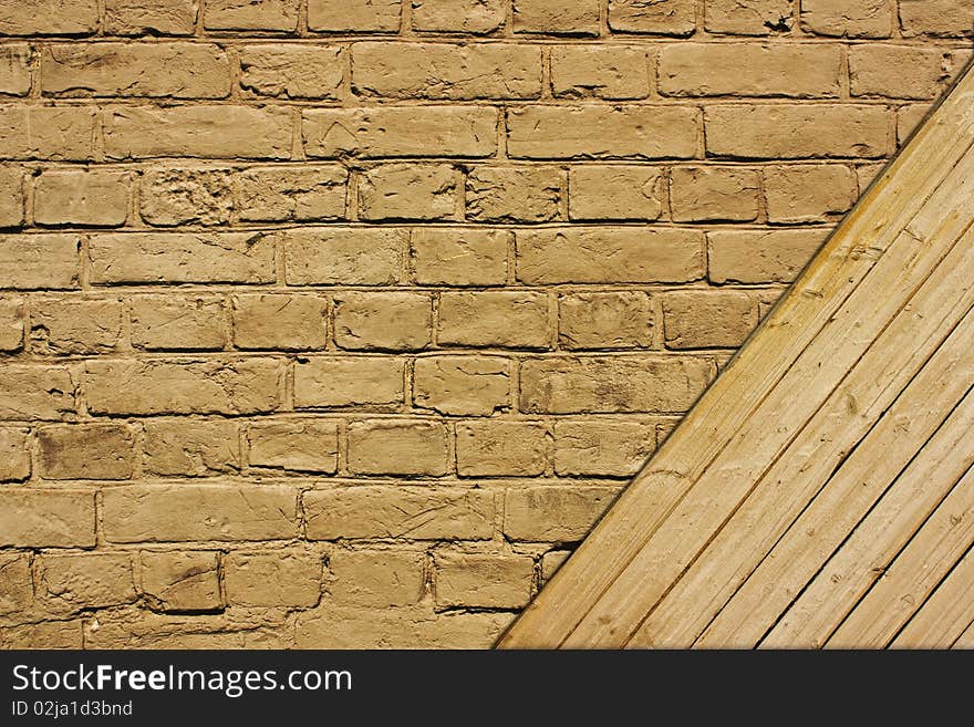 Vintage brown textured brick and wooden wall. Vintage brown textured brick and wooden wall