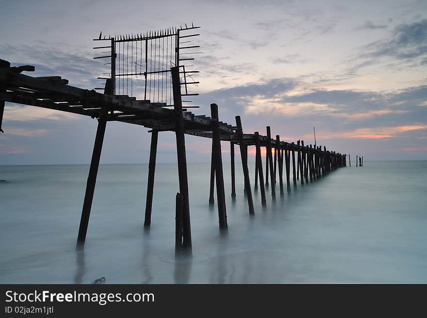 The decay pier and steel gate in the  twilight time