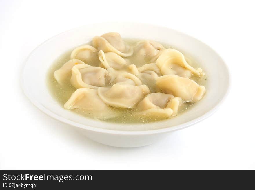 Ravioli in plate  close-up on white background