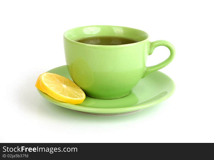 Cup of tea with lemons and lumps of sugar