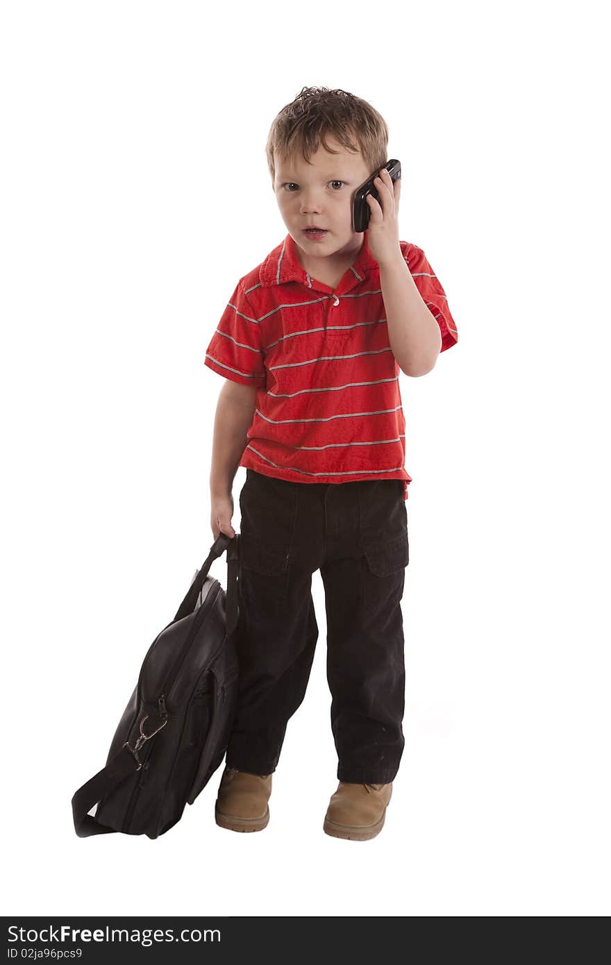 A young boy is in shock while talking on his cell phone. A young boy is in shock while talking on his cell phone.