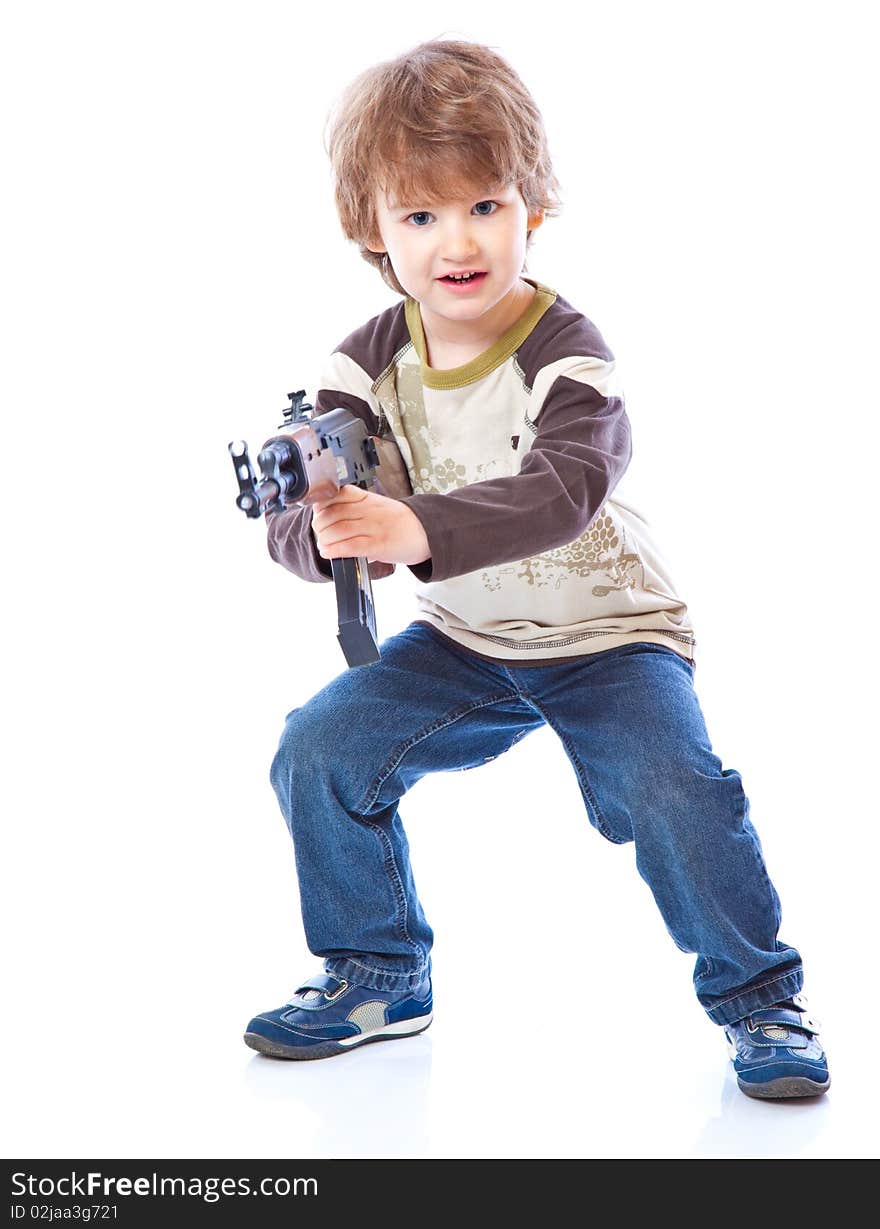 Portrait of little boy with automatic weapon (Kalashnikov). Isolated on white background