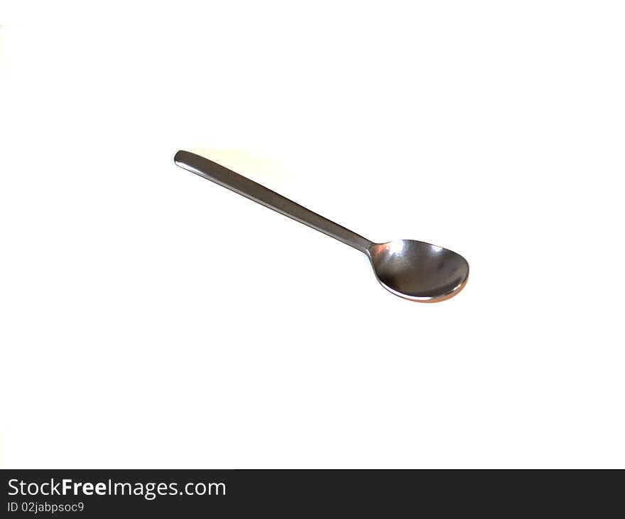 Steel spoon on white background